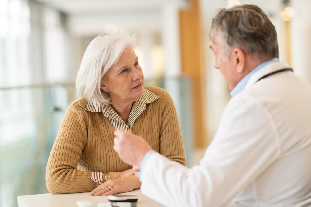 A doctor speaking with a patient