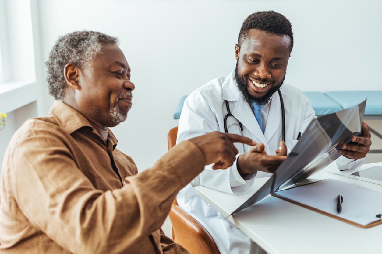 Doctor showing x-ray image to patient